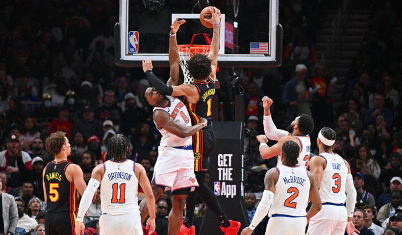 Atlanta Hawks forward Jalen Johnson dunks on New York Knicks forward OG Anunoby.