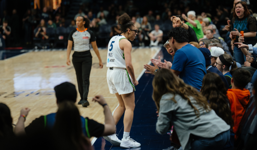 Olivia Miles celebrating with Lynx crowd