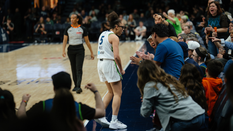 Olivia Miles celebrating with Lynx crowd