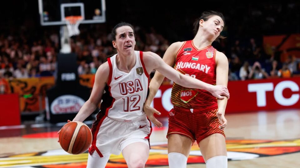 United States guard Caitlin Clark drives with the ball as a Hungary defender leans away on contact. 2026 FIBA World Cup, Women's Basketball.